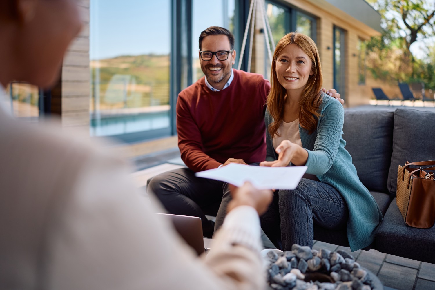 Real estate investor presenting deal package to hard money lender